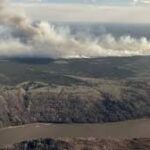 Rain stalls wildfire near Canadian oil city