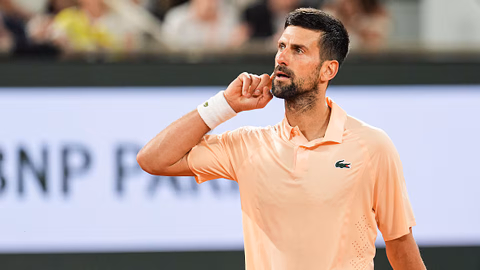 Djokovic overcomes hostile crowd in first round win
